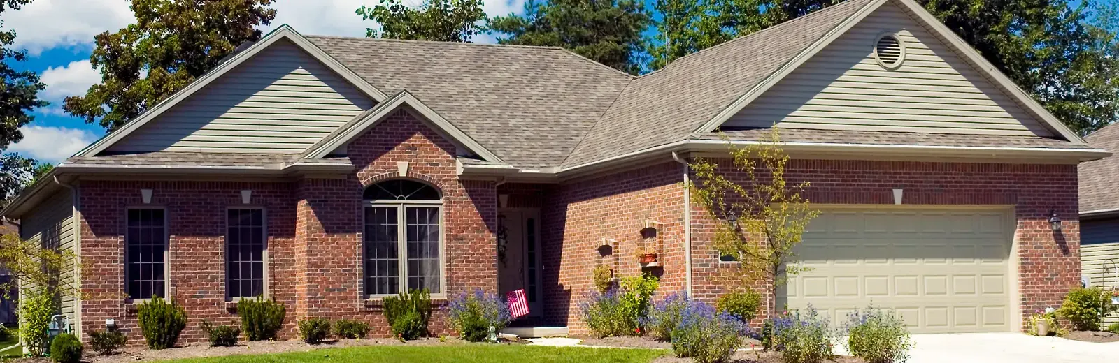 ranch brick home with nice lawn