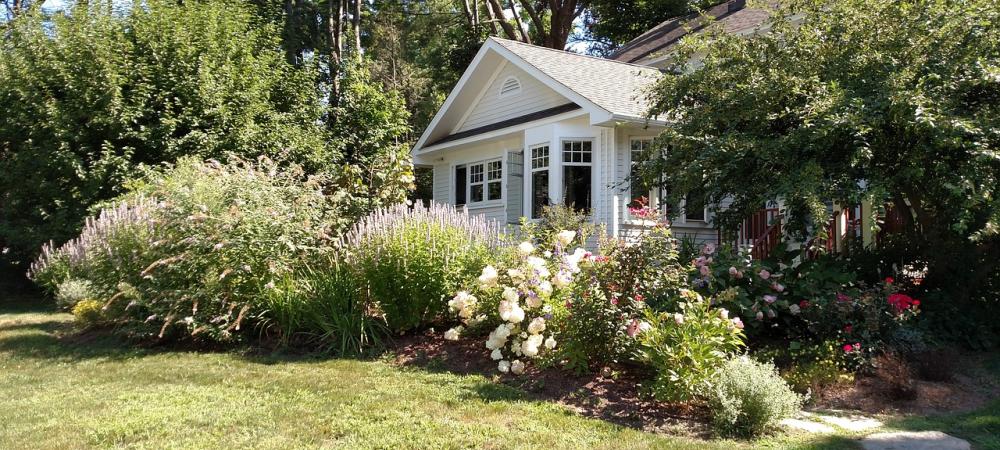 House with Flowering Landscape